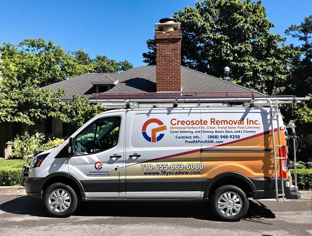 North Reading Chimney Sweep technician removing creosote safely in North Reading, MA