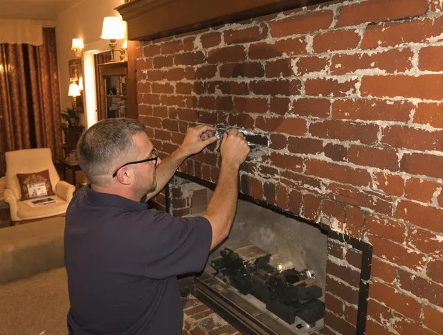 North Reading Chimney Sweep expert fixing a fireplace in North Reading, MA